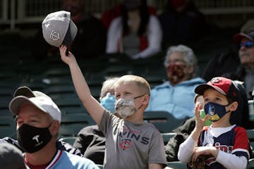 Twins fans like friends Jake Renner, 6, and Cameron Leapaldt, 5, from Chanhassen, will be happy to hear about the lifting of COVID-19 restrictions inc