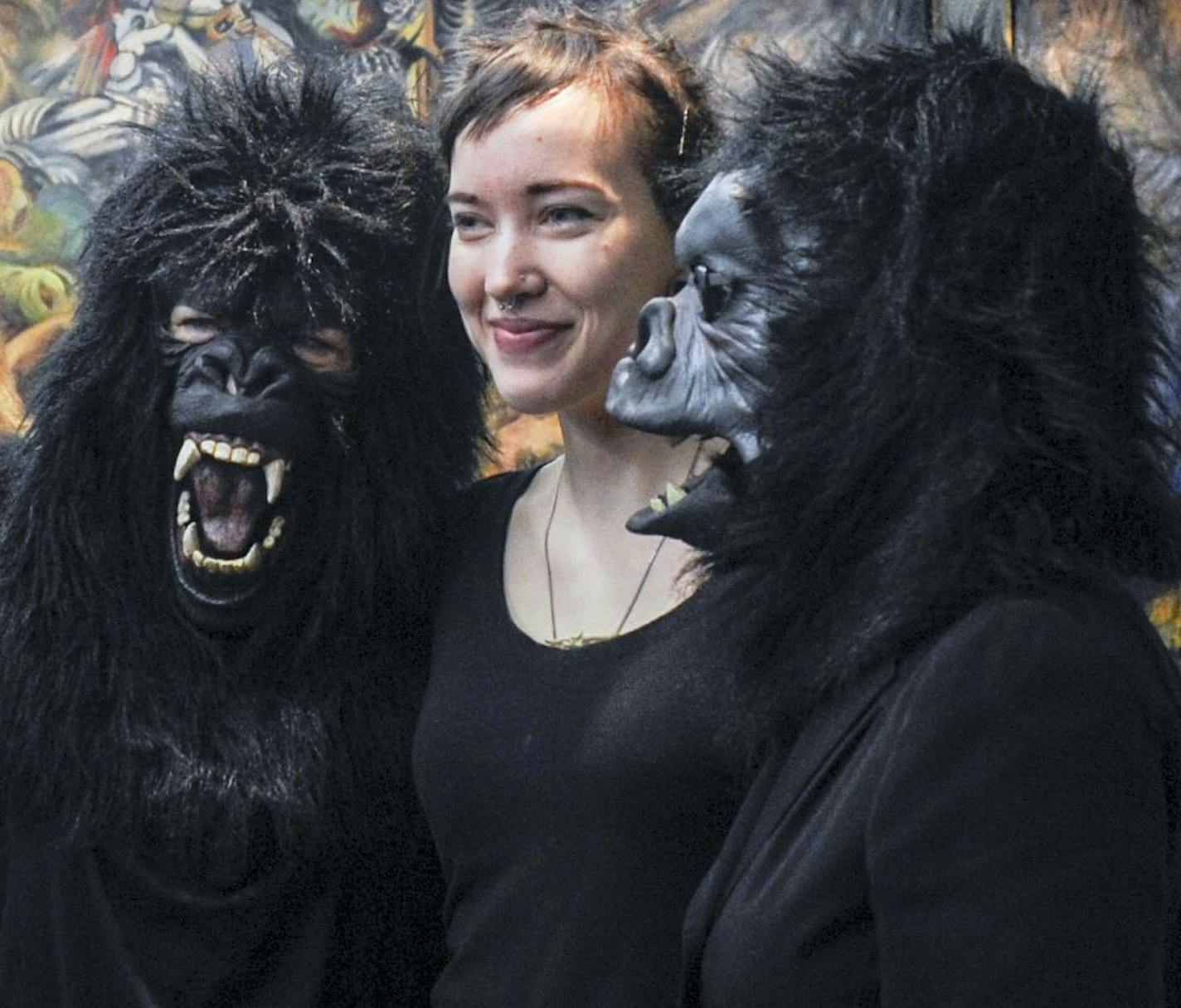 Guerrilla Girls Frida Kahlo and K&#xe4;the&#xa0;Kollwitz posed for a snapshot with MCAD student intern Sara Suppan, who helped organize the group's upcoming "takeover" of Twin Cities art museums and galleries.