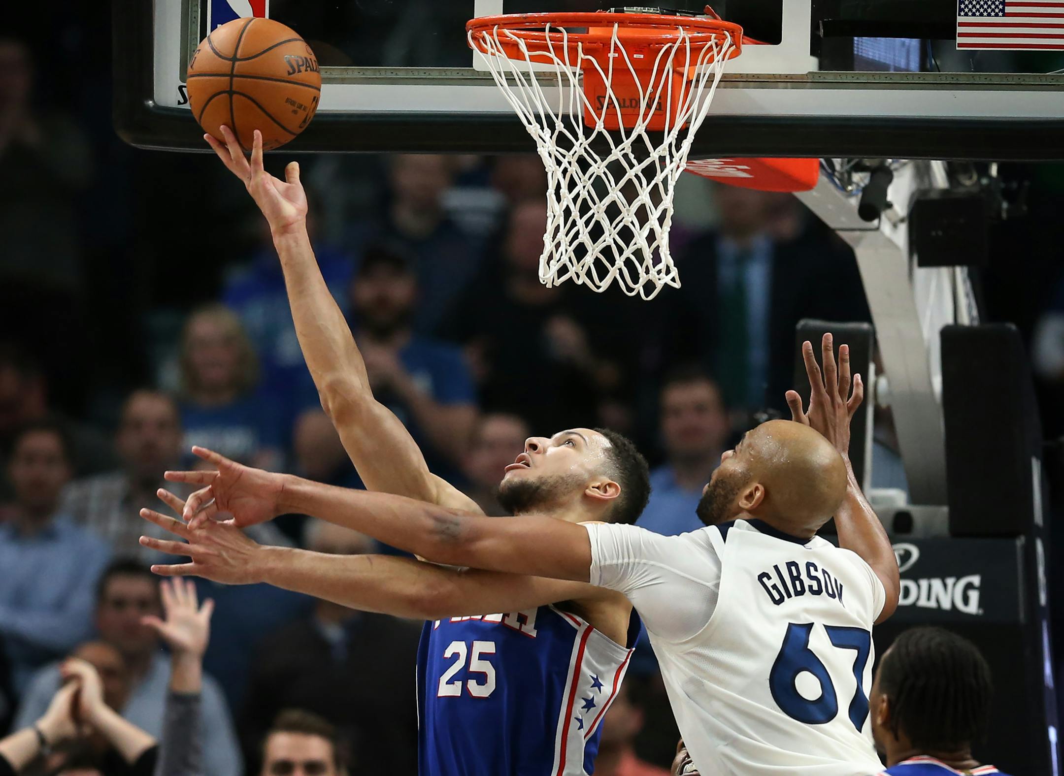 Philadelphia 76ers guard Ben Simmons (25) scored on a reverse layup in overtime on Minnesota Timberwolves forward Taj Gibson (67) during NBA action at Target Center Tuesday December 12, 2017 in Minneapolis, MN.] The Minnesota Timberwolves hosted the Philadelphia 76ers at Target Center. JERRY HOLT � jerry.holt@startribune.com