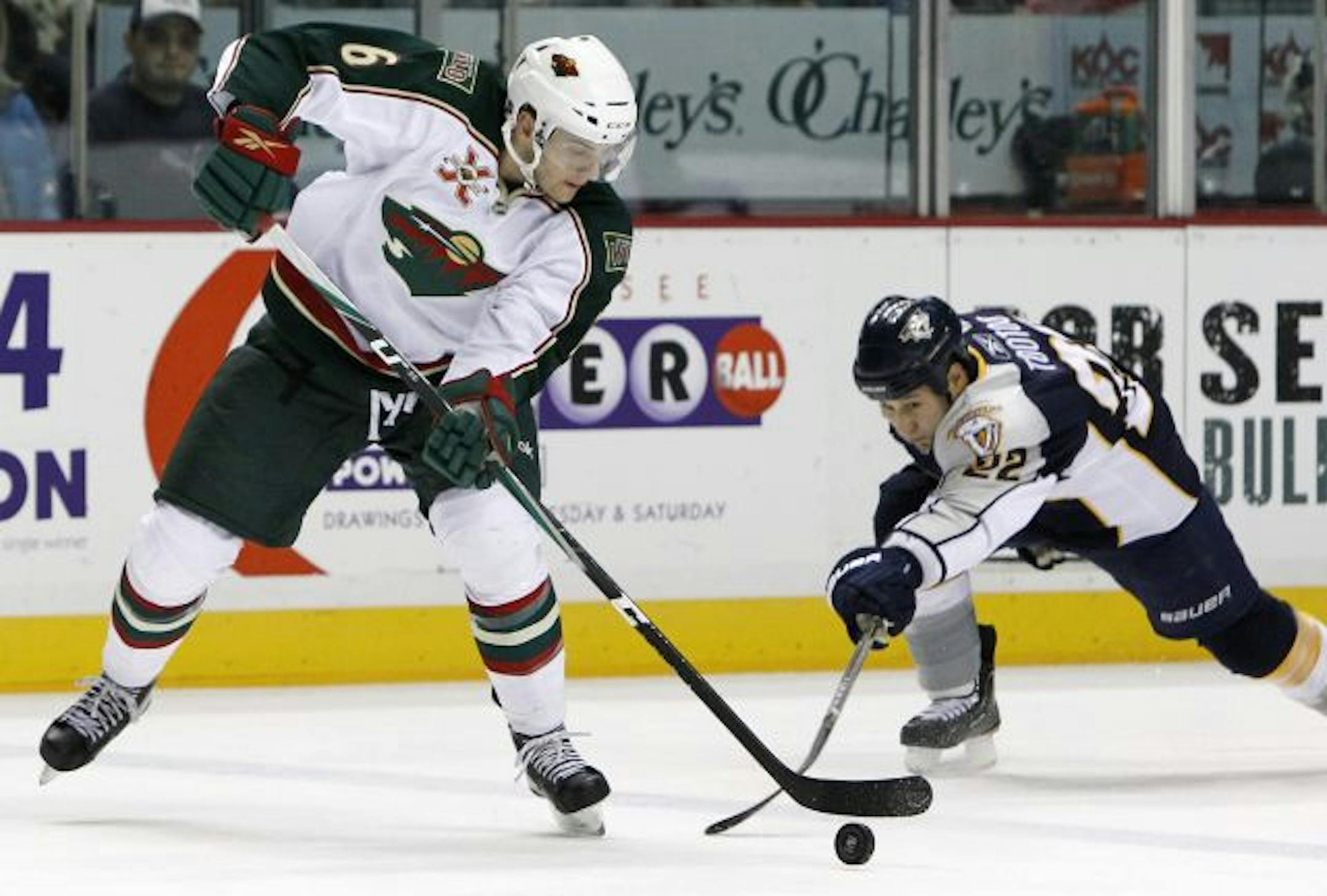 Wild defenseman Marco Scandella (left)