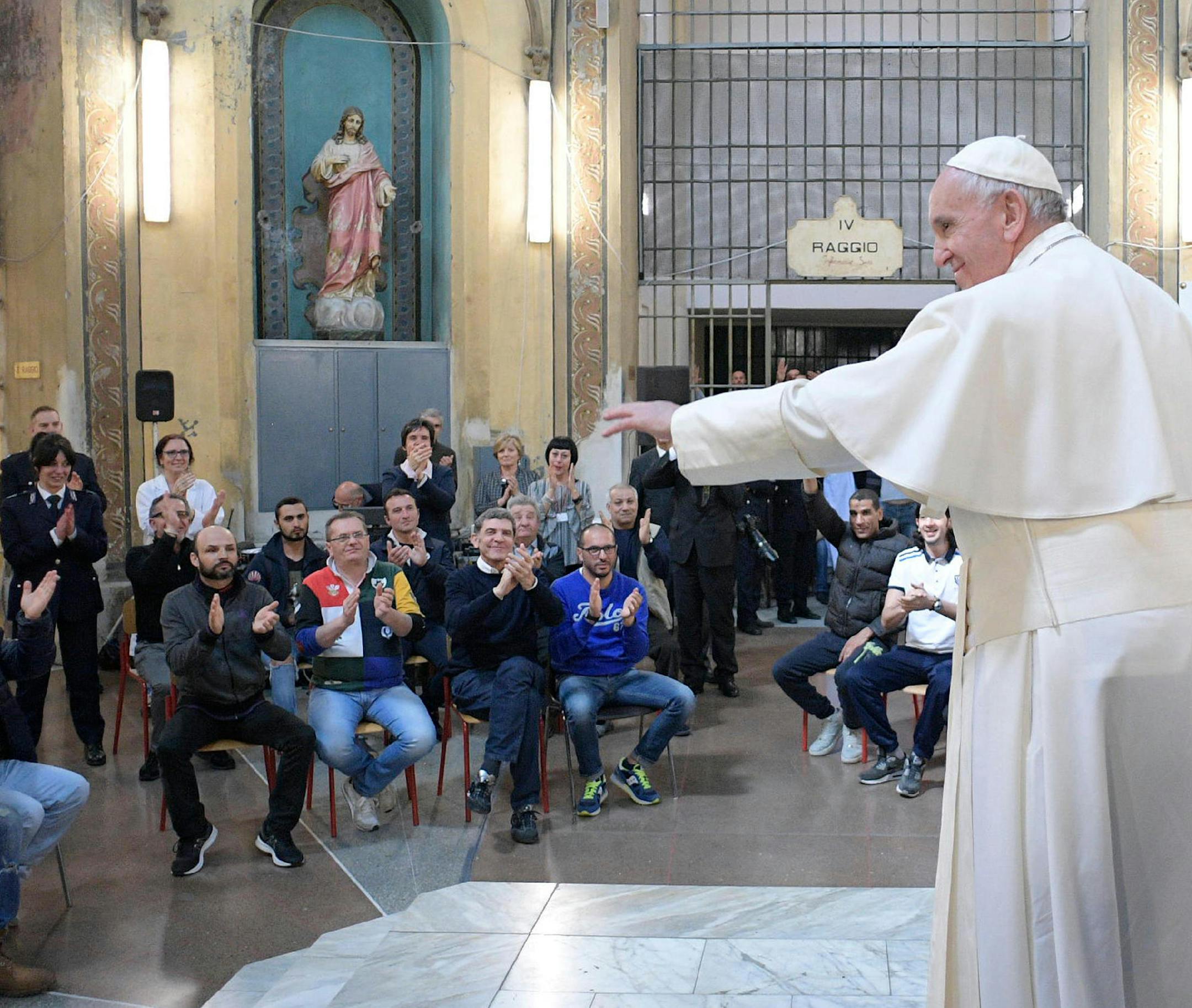 Pope Francis meets with prisoners at the San Vittore penitentiary in Milan, as part of his one-day pastoral visit to Monza and Milan, Italy’s second-largest city, Saturday, March 25, 2017. Pope Francis began his one-day visit Saturday to the world's largest diocese which included a stop at the city's main prison as well as a blessing at the Gothic-era Duomo cathedral. (L'Osservatore Romano/Pool Photo via AP)