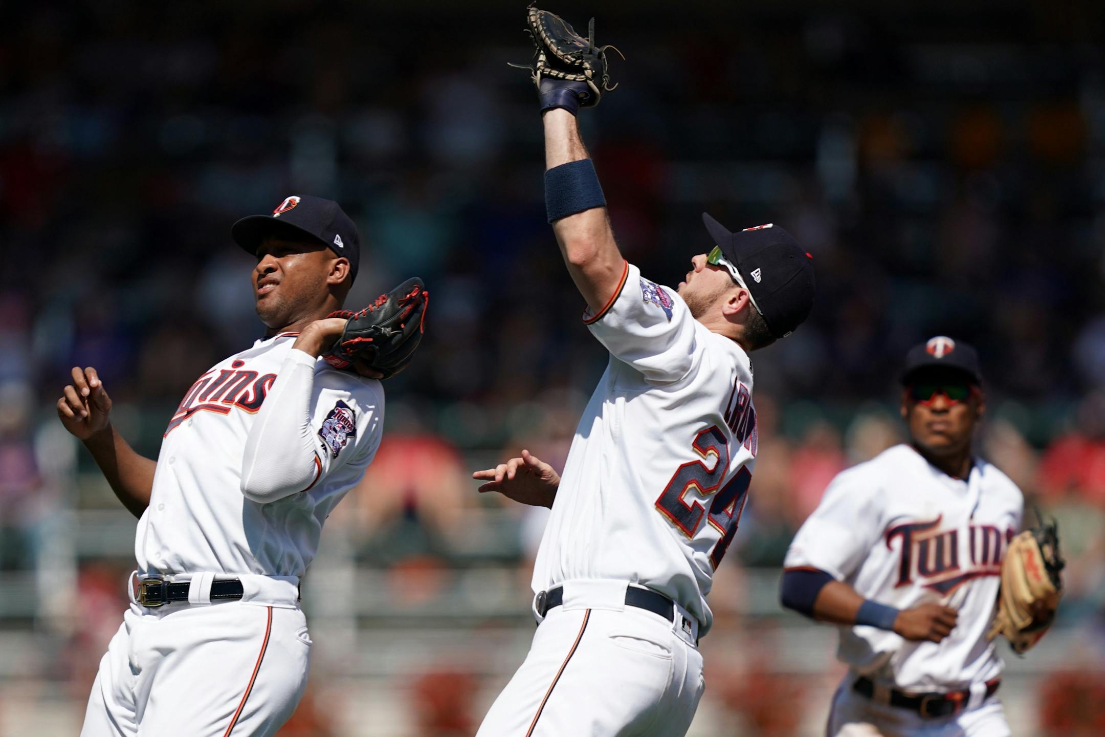 Minnesota Twins first baseman C.J. Cron (24) called off second baseman Jonathan Schoop (16) as he fielded a pop fly hit by Atlanta Braves catcher Tyler Flowers (25) in the ninth inning.