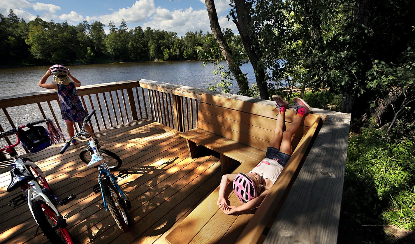 Lucy Engelstad, 6 (right) took a break from riding along a trail on the banks of the Mississippi River in Brainerd. At left is friend, Rebekah Soukup, 8. ] JIM GEHRZ &#xef; james.gehrz@startribune.com / St. Cloud and Brainerd, MN / July 30, 2015 / 10:00 AM &#xf1; BACKGROUND INFORMATION: Cities along rivers are turning to face them. Winona is weighing a $3 million overhaul of Levee Park to celebrate the Mississippi River and make it easier to access. Red Wing is working on a similar, $5 million p