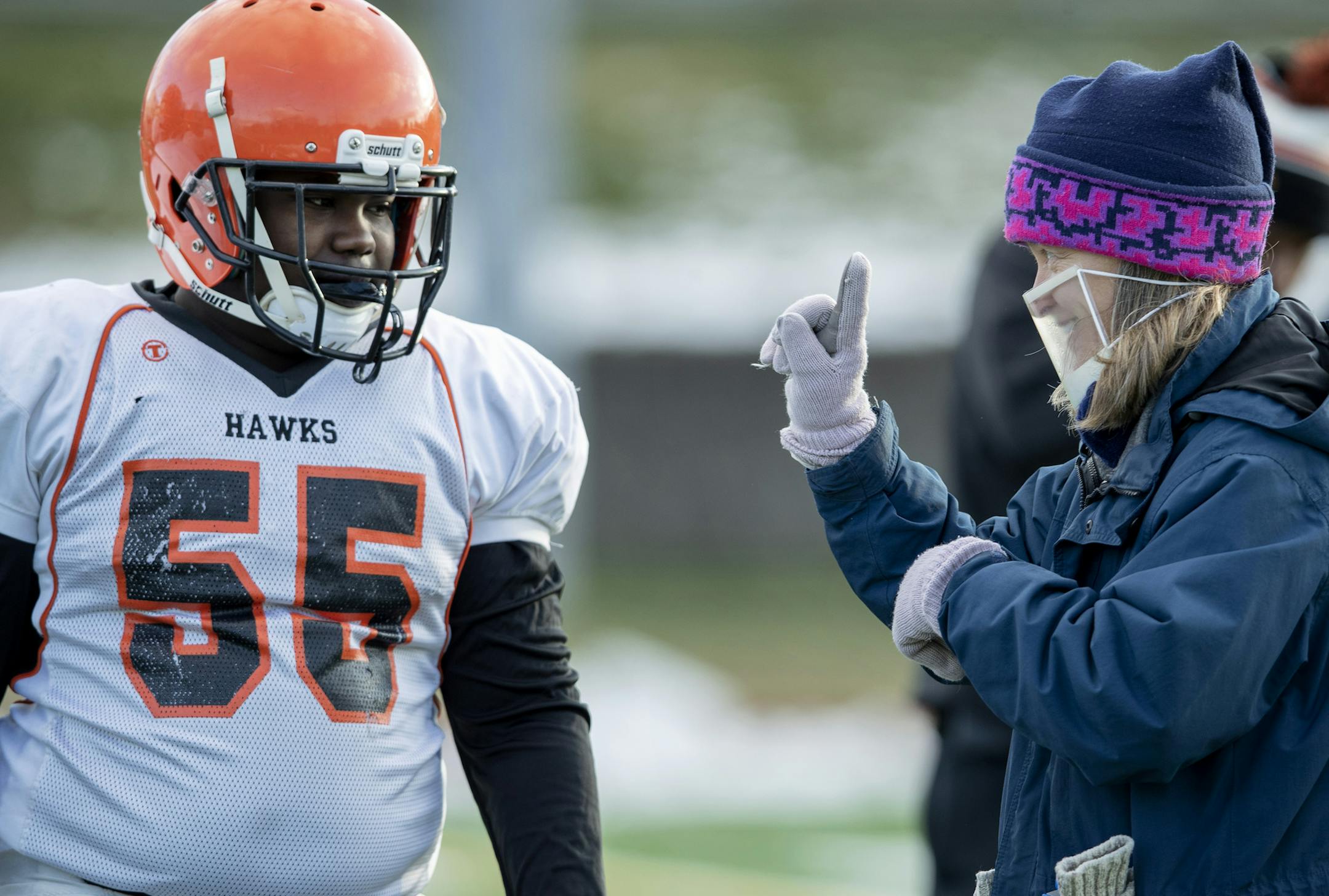 Humboldt High School lineman Sam Smith communicated with ASL interpreter Sue Snyder at a game vs. Como Park. ] CARLOS GONZALEZ • cgonzalez@startribune.com – St. Paul, MN, October 2020, Humboldt High School Football player Sam Smith