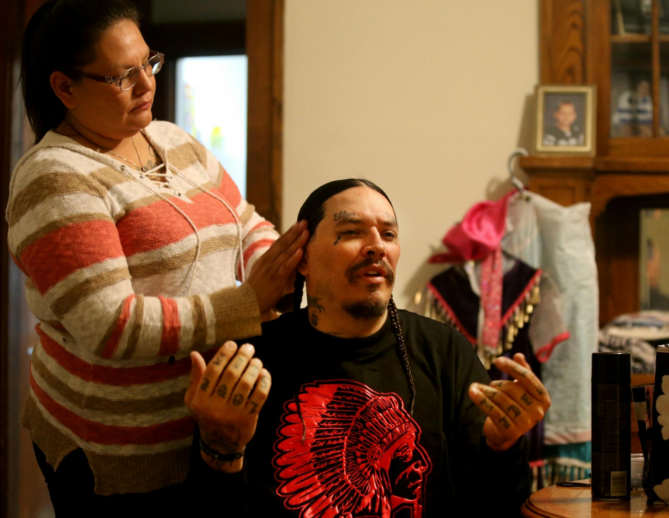 This week, after months of living at a crowded homeless camp, Mike and Ellen Eagletail and their three children finally moved into a place of their own. They are among a small but growing number of people at a south Minneapolis homeless camp who are starting to find housing. At the start of every day, Ellen braids the hair of Mike and their children Thursday, Oct. 25, 2018, in Minneapolis, MN. Now they can do it from the family's new, heated apartment Thursday, Oct. 25, 2018, in Minneapolis, MN.