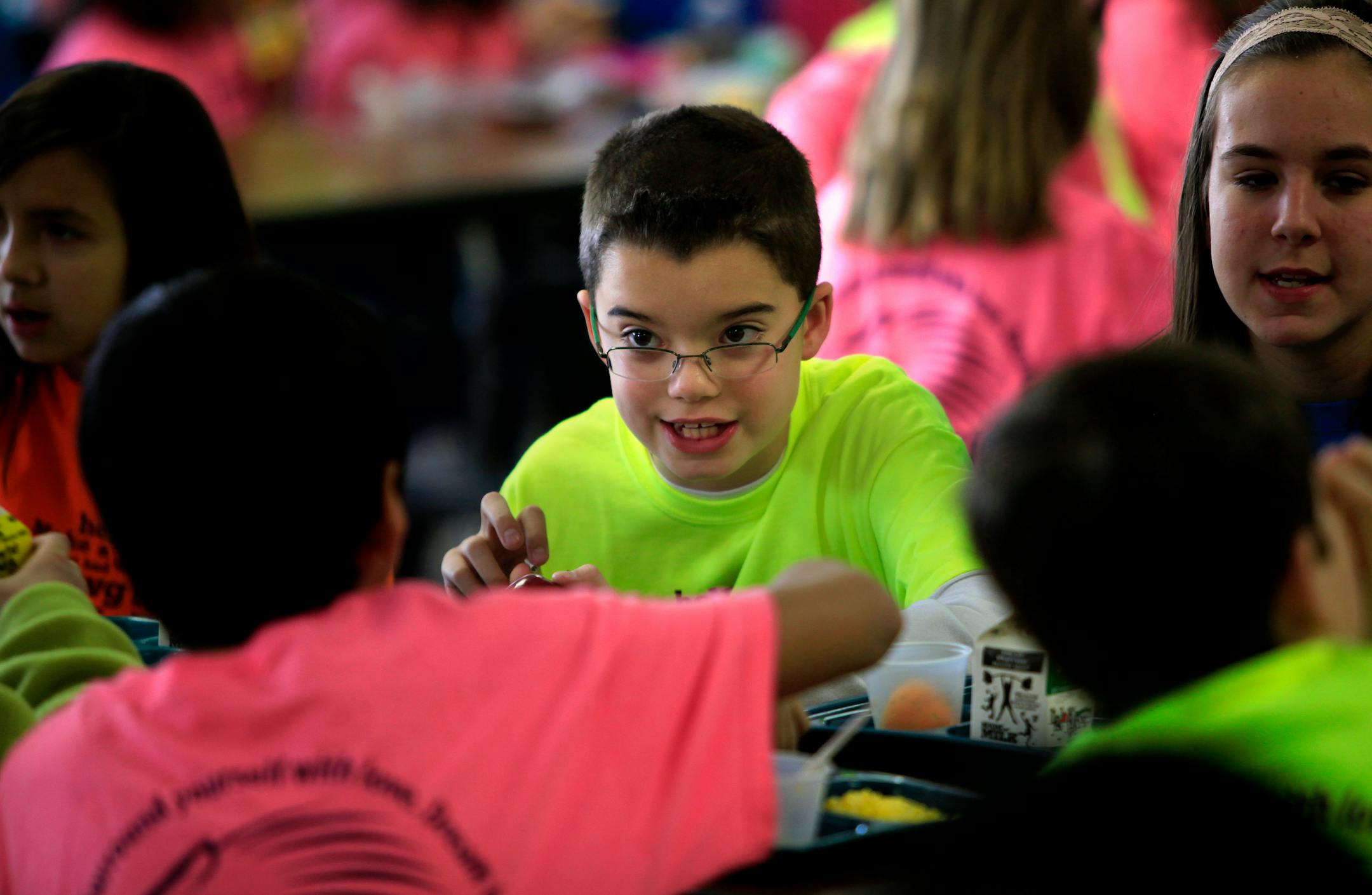 Jarrett Michie, 10, talks with one of his classmates during lunch at Diamond Path School in Apple Valley, MN on January 23, 2013.