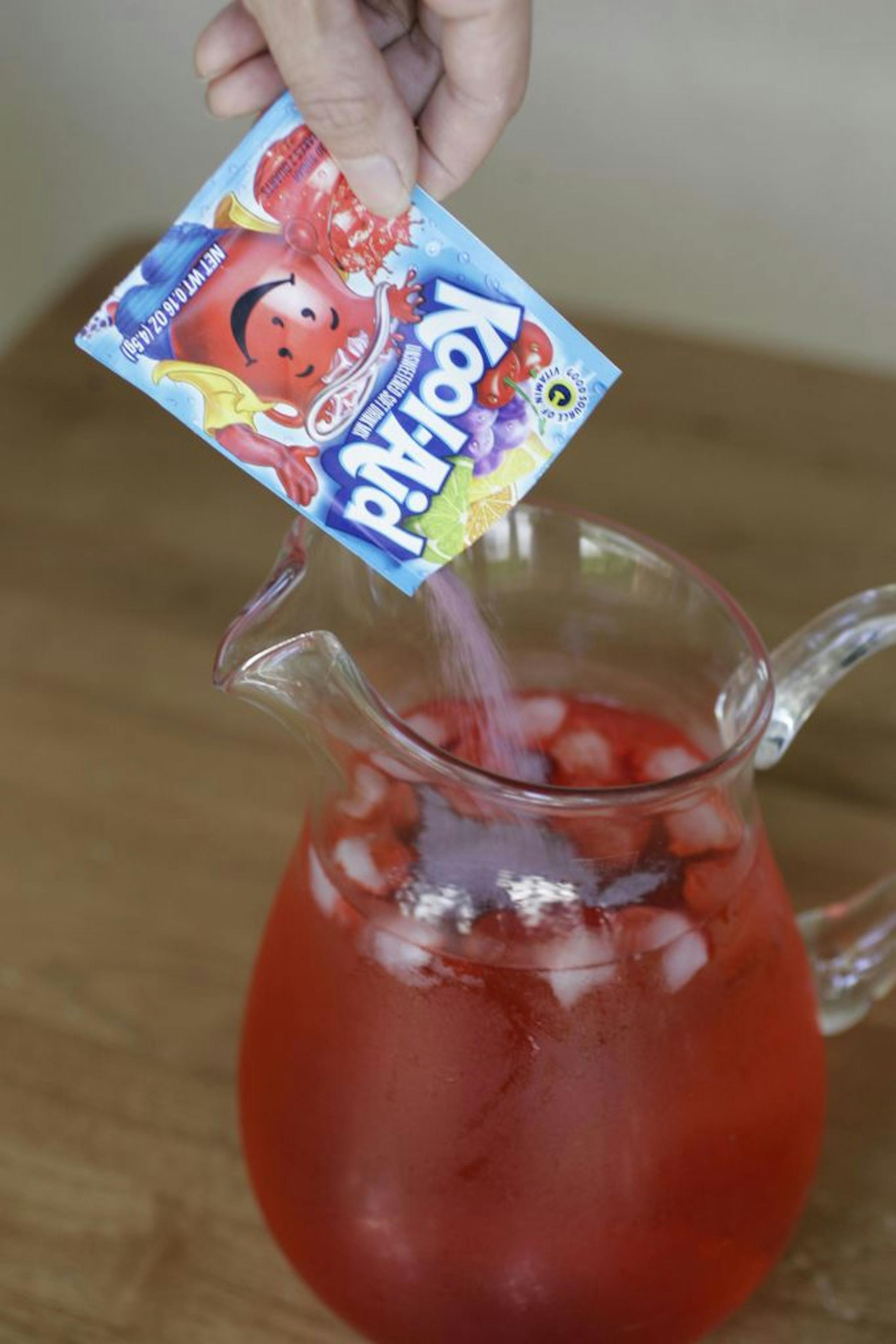 In this Monday, July 28, 2008, photo, Sharon Robinson makes Tropical Punch Kook-Aid, which is made by Kraft Foods, in Palo Alto, Calif. The death of Trayvon Martin, 17, at the hands of a neighborhood watchman in February ignited many demonstrations of protestors carrying bags Skittles while marching for the arrest of shooter George Zimmerman. But Skittles are not the first popular food brand to find itself at the center of a major controversy. The terms �the Twinkie defense� and �don't drink the