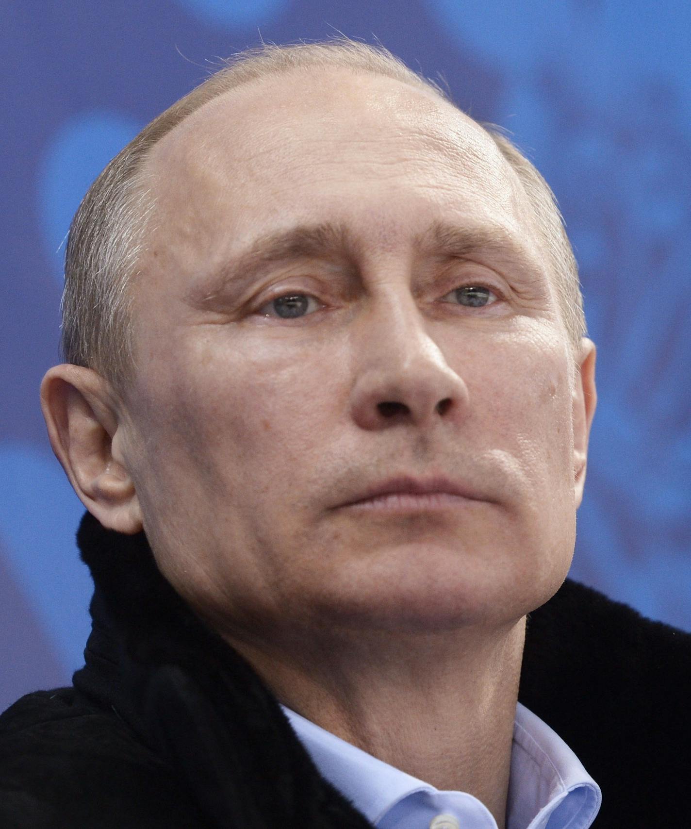 In this photo taken Saturday, March 8, 2014, Russian President Vladimir Putin, left, and International Olympic Committee President Thomas Bach watch the ice sledge hockey match between Russia and South Korea of the 2014 Winter Paralympics in Sochi, Russia. (AP Photo/RIA-Novosti, Alexei Nikolsky, Presidential Press Service)