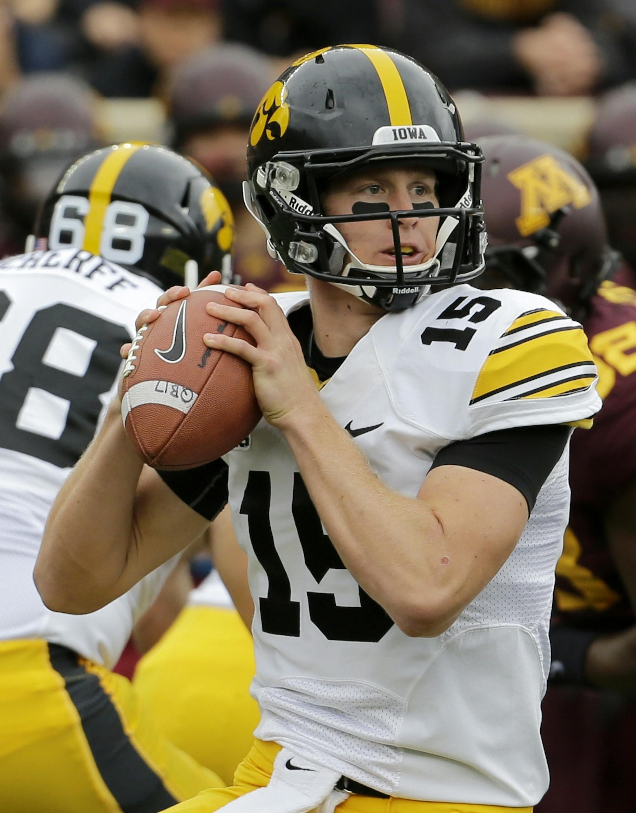 Iowa quarterback Jake Rudock (15) drops back for a pass during the first quarter of an NCAA college football game against Minnesota in Minneapolis Saturday, Sept. 28, 2013. (AP Photo/Ann Heisenfelt) ORG XMIT: NYOTK