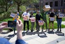 Activists posed in April with signed petitions calling for replacing the Minneapolis Police Department with a new Department of Public Safety; for eli