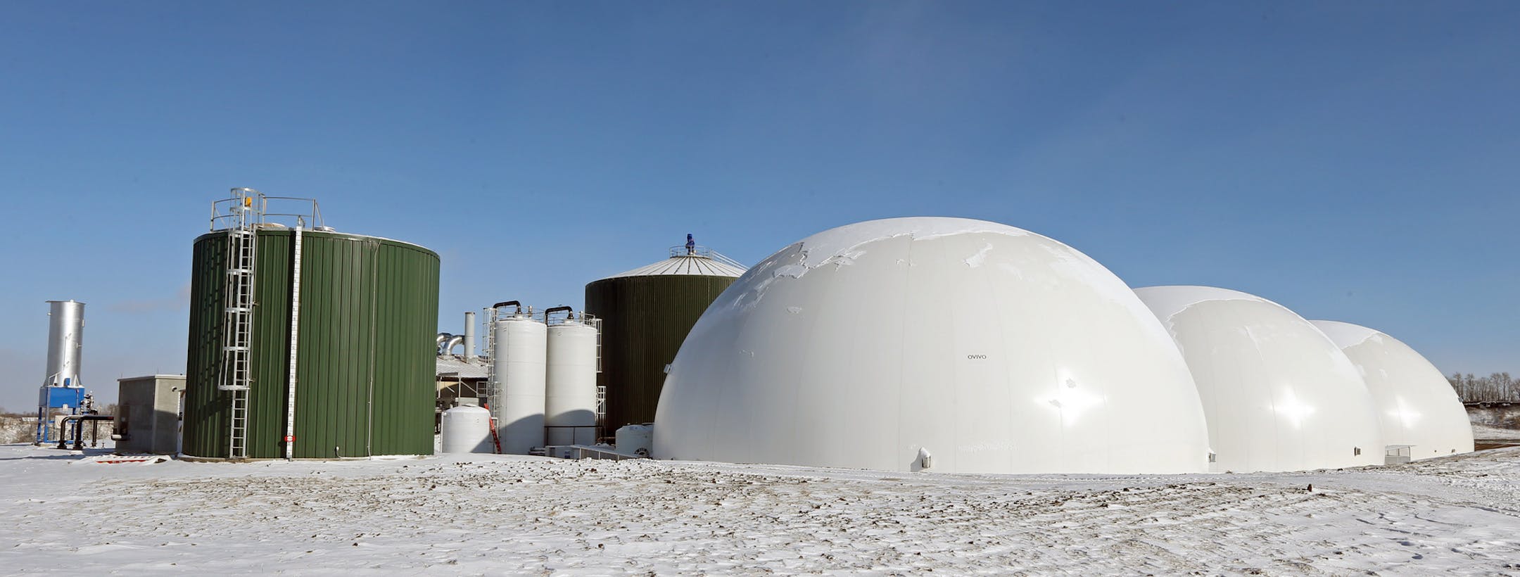 Large digester tanks hold the slurry for 30 days during the conversion process and white domes hold biogas at the Hometown Bioenergy plant in Le Sueur, MN, on 12/5/13. The plant is highly automated, when finished only three workers will man the plant. One of Minnesota's most ambitious green energy projects is almost complete. The "Hometown Bioenergy" plant, now almost completed in Le Sueur, Minn., will be one of the largest in the nation to turn agricultural waste into biogas and burn it to prod