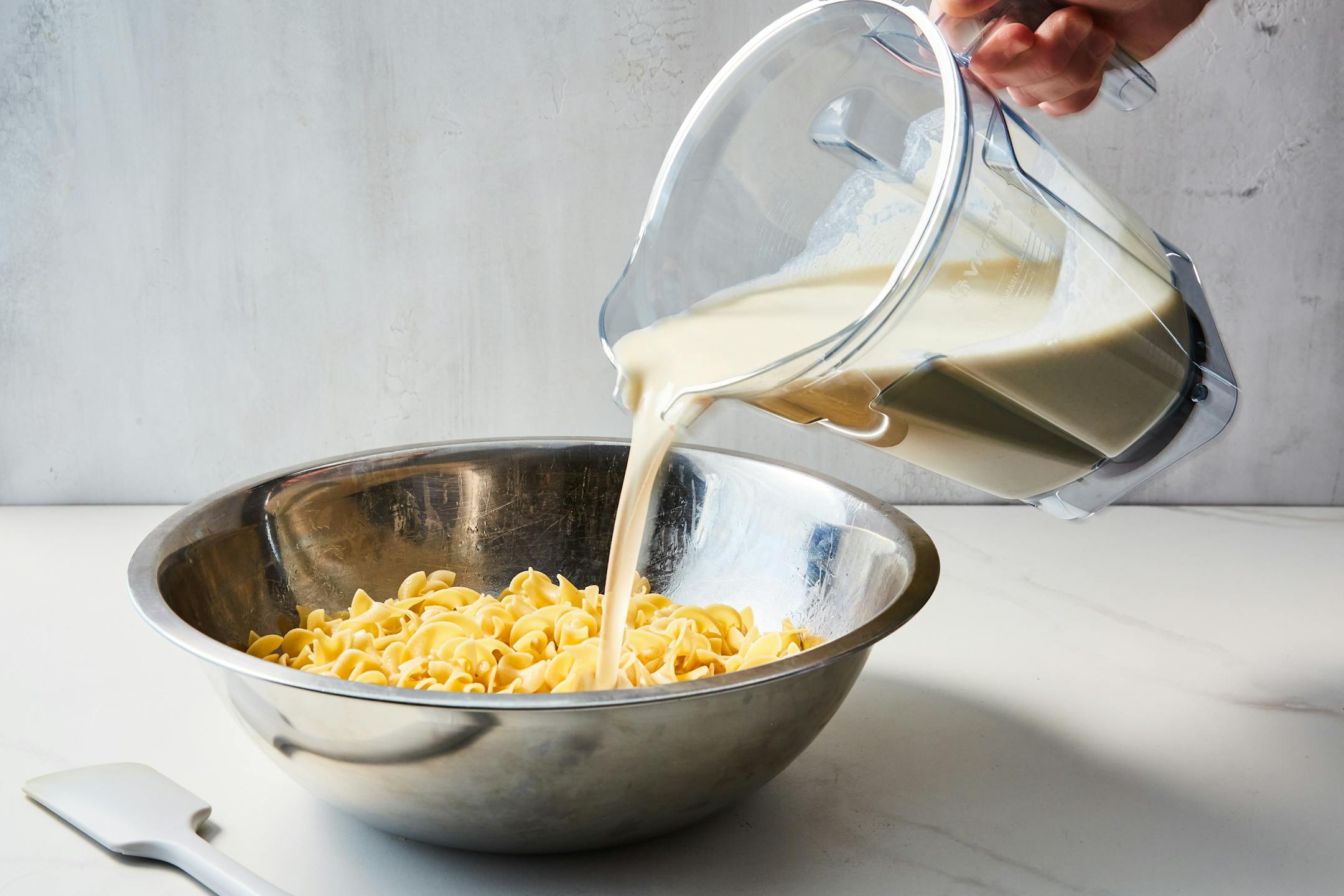 A classic sweet noodle kugel, rich with sour cream, cottage cheese, light brown sugar and optional raisins, in New York, Nov. 22, 2022. For most kugel lovers, the very best version is whatever you grew up eating, whether you were raised on savory, schmaltz-laden potato kugel or sour cream-slathered noodle kugel dotted with raisins, there's very little crossover where kugel is concerned. Food styled by Brett Regot. (Linda Xiao/The New York Times)