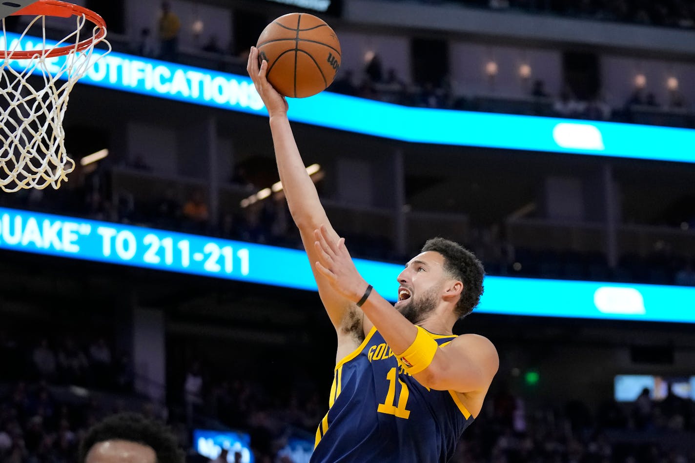 Golden State Warriors guard Klay Thompson scores against the Minnesota Timberwolves during the second half of an NBA basketball game in San Francisco, Sunday, Feb. 26, 2023. (AP Photo/Jeff Chiu)