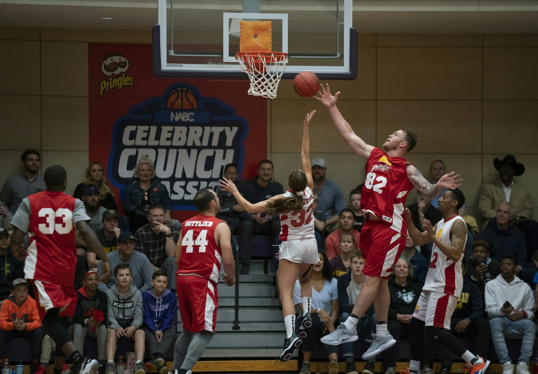Team Pringles Kyle Rudolph swatted away a shot by Team Cheez-It's Rachel DeMita. DeMita played D I basketball for Old Dominion University and went on to be the host of NBA 2KTV.