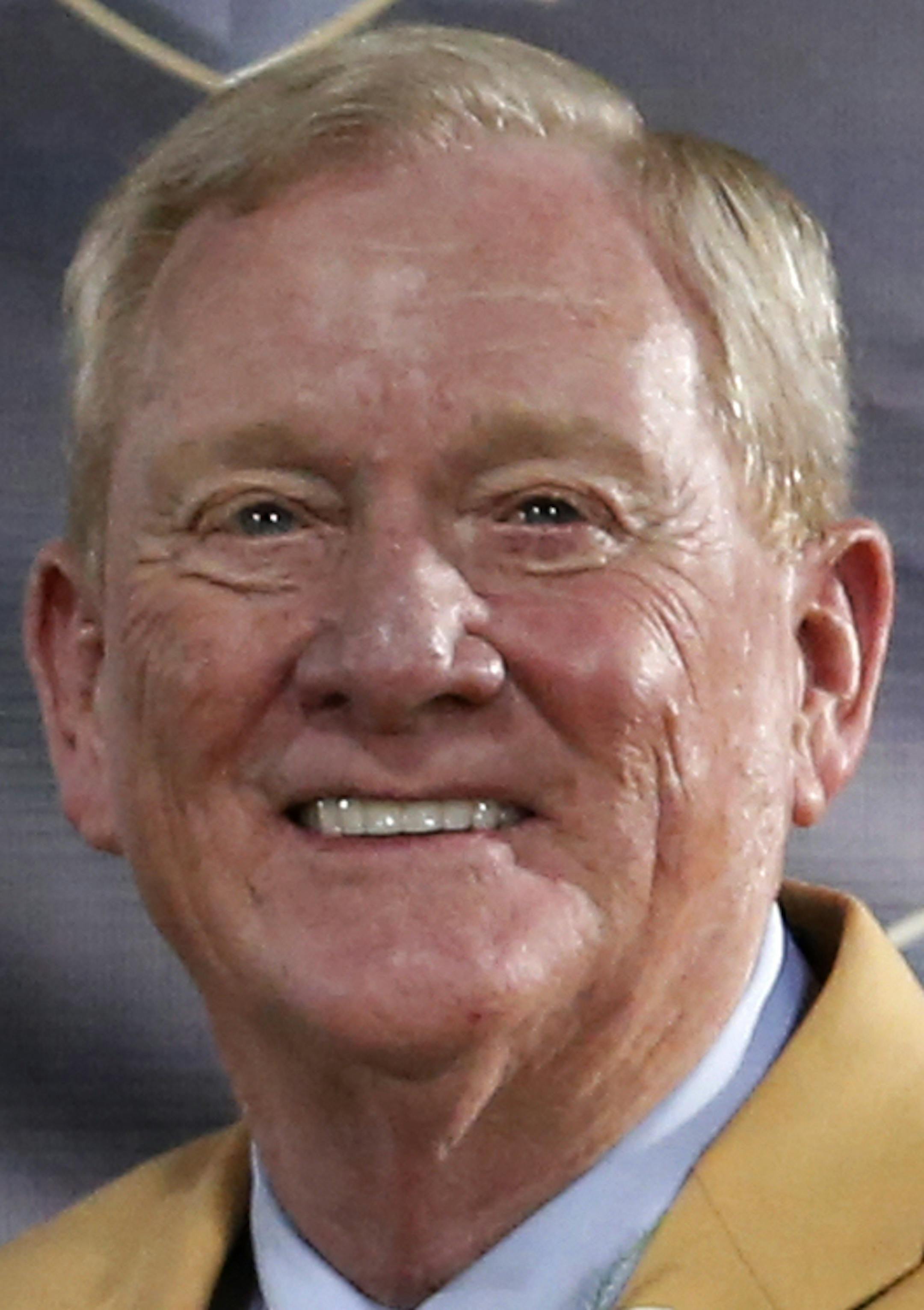 Former President and General Manager of the Indianapolis Colts Bill Polian poses with his bust during an induction ceremony at the Pro Football Hall of Fame Saturday, Aug. 8, 2015, in Canton, Ohio. (AP Photo/Gene J. Puskar)