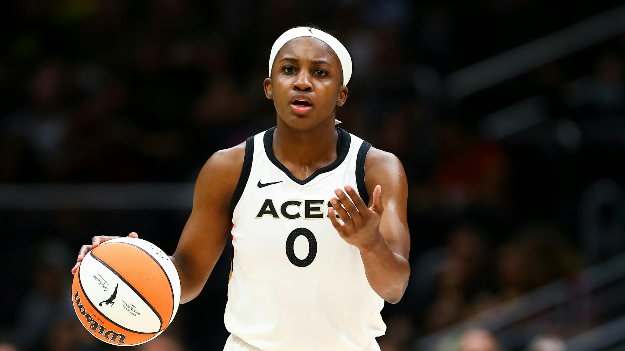Las Vegas Aces guard Jackie Young (0) gestures while dribbling during the first half in Game 3 of a WNBA basketball semifinal playoff series Sunday, Sept. 4, 2022, in Seattle. (AP Photo/Lindsey Wasson)