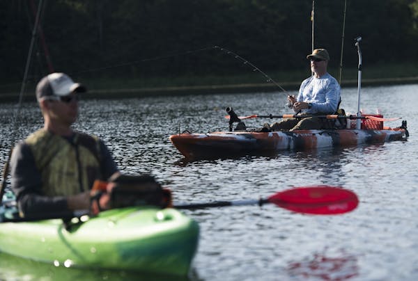 KP Enderle, right, tested the waters with his line along with Pat Caldwell. ] Isaac Hale &#xef; isaac.hale@startribune.com Kayak fishermen took to Mur