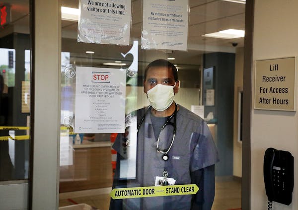 Emergency Room physician Dr. Mohammed I. Hussain seen just inside the Emergency Room entrance CentraCare Health - Monticello Thursday, May 21, 2020, i