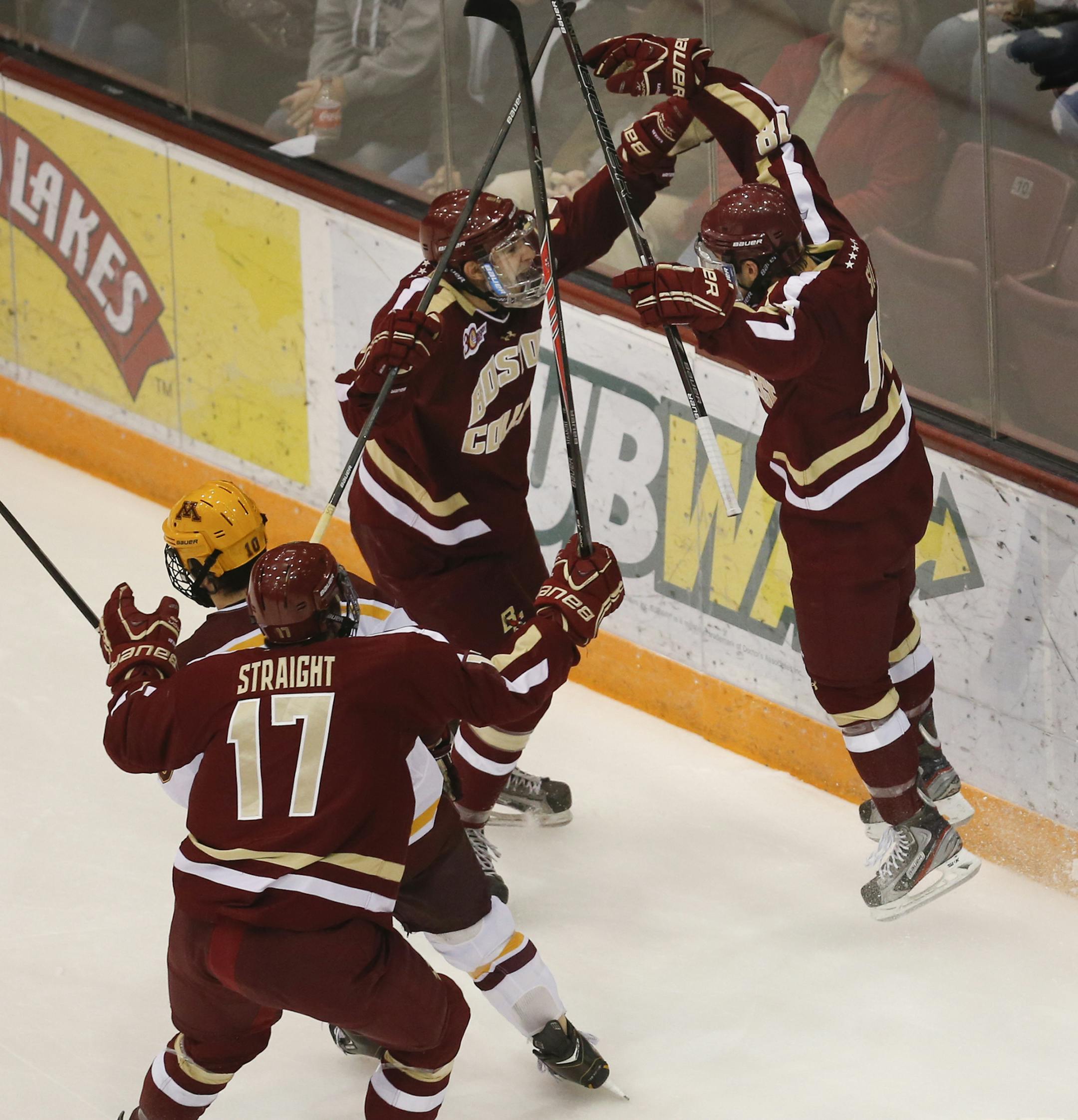 Boston College's Michael Sit (18) center, celebrates with teammate after his second, first period goal against the Gophers.