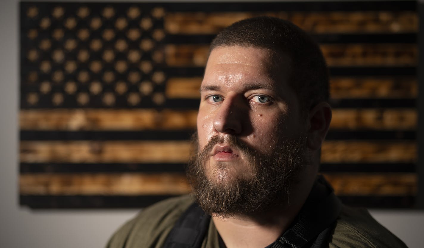 Michael Solomon, photographed at home in New Brighton Wednesday evening. ] JEFF WHEELER • Jeff.Wheeler@startribune.com Michael Robert Solomon, a 30-year-old north metro man, spent weeks alongside a group of fellow armed members of the Boogaloo Bois movement on the streets of Minneapolis. He said they were there to protect the neighborhood's homes and small businesses as unrest over George Floyd's death descended into riots. He was photographed at his New Brighton home Wednesday afternoon, July 8