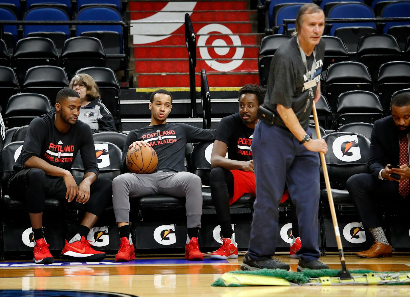 Crews wiped the floor at Target Center for Monday's game between the Timberwolves and Portland Trail Blazers. Ice under the floor and unseasonably warm, humid weather caused some condensation on the wood floor.