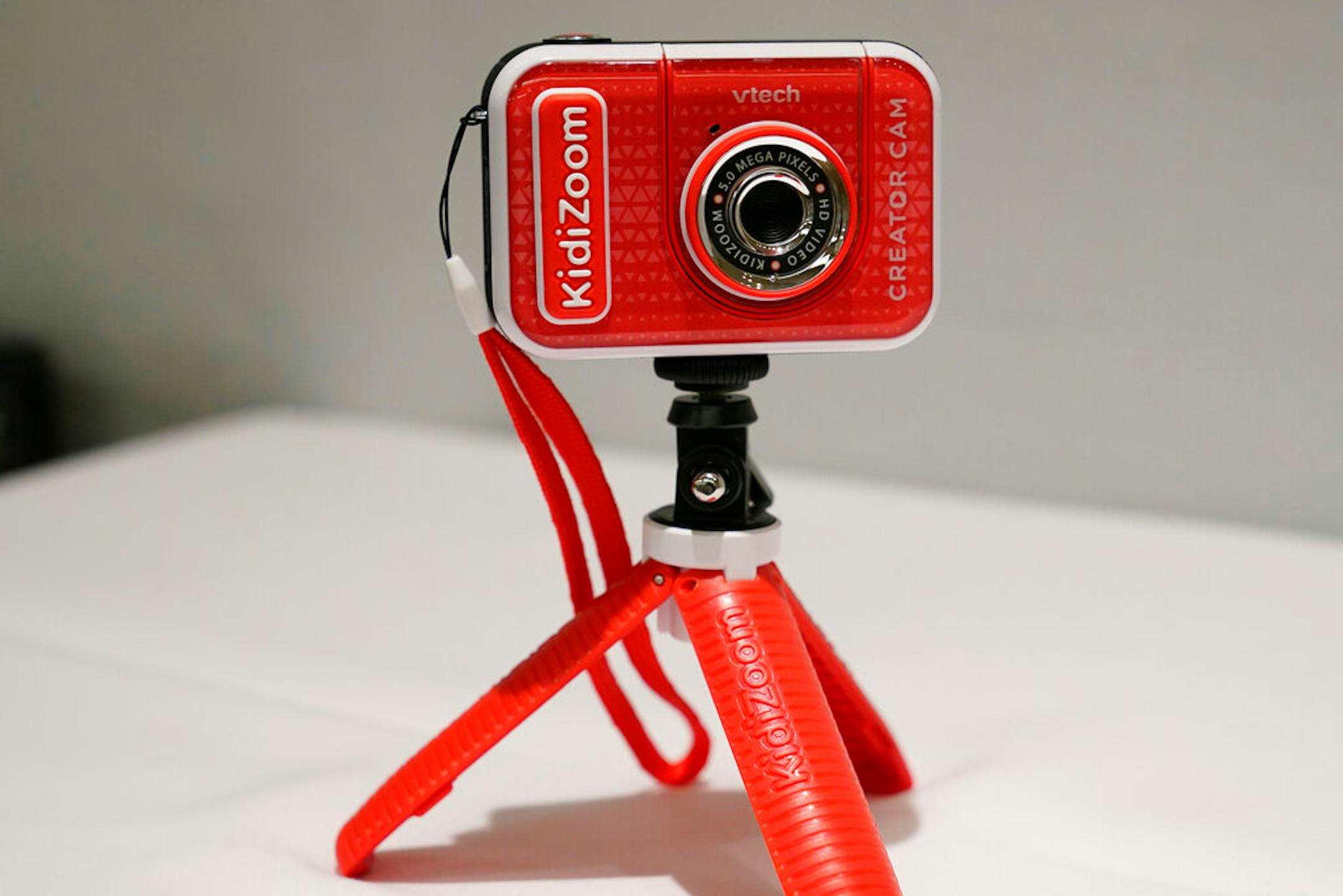 A KidiZoom Creator Cam by VTech is displayed at the Toy Fair, Thursday, Sept. 17, 2020, in New York. The digital camera comes with a green screen and animated backgrounds allowing kids to go to outer space, get chased by T-Rex, or make things disappear. The camera comes with a tabletop tripod, which can also be used as a selfie stick.