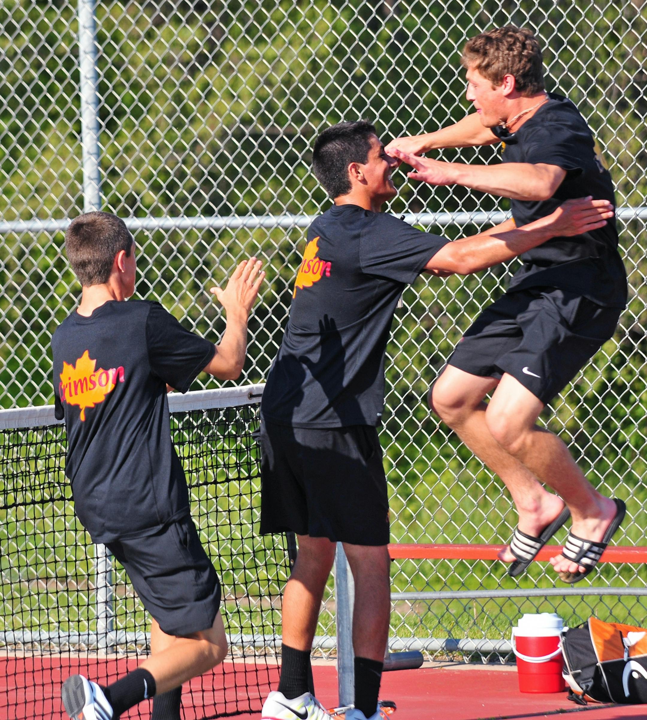Maple Grove teammates celebrated with freshman Rory Calabria, center, after he beat Mounds View's Henry Morris. Photo by BRE McGEE • Special to the Star Tribune