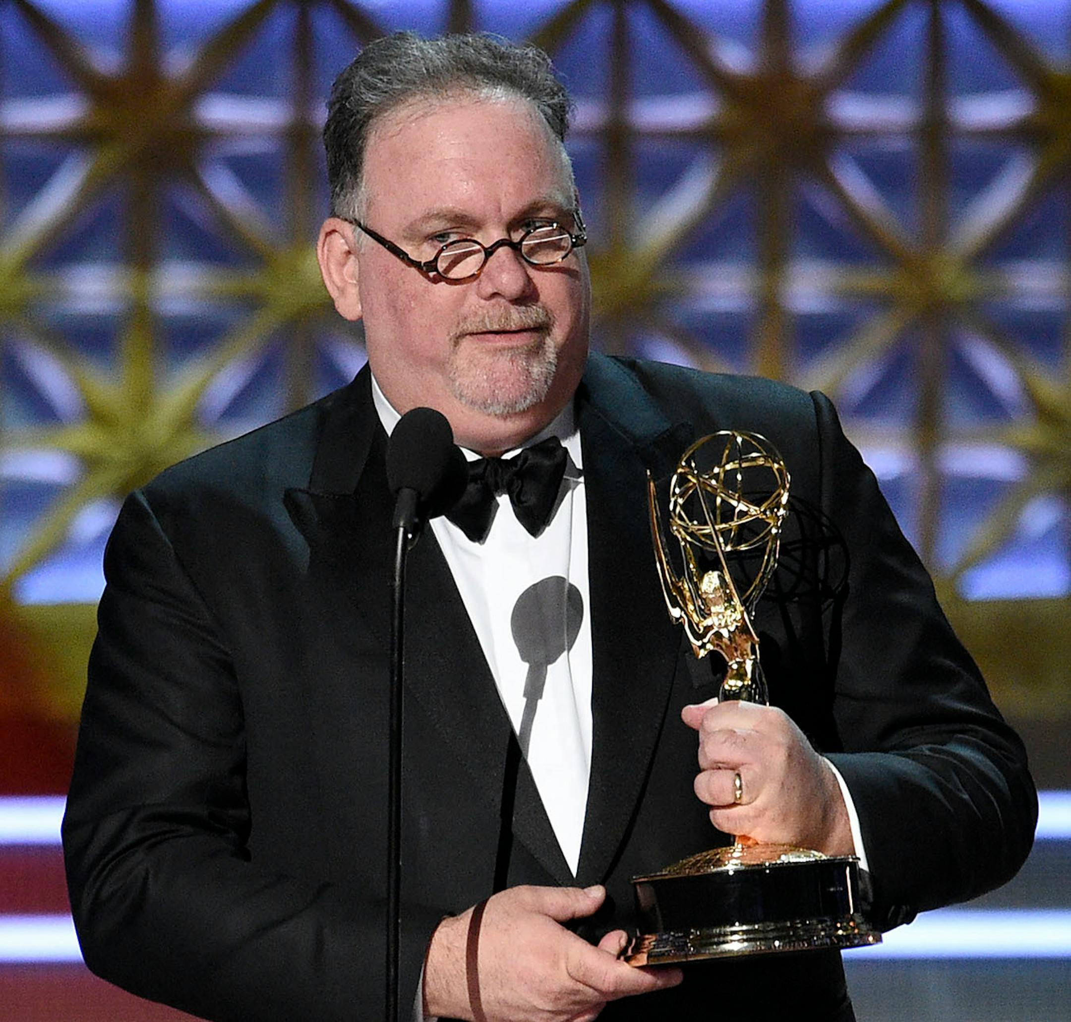 Bruce Miller accepts the award for outstanding writing for a drama series for "The Handmaid's Tale" episode "Offred (Pilot)" at the 69th Primetime Emmy Awards on Sunday, Sept. 17, 2017, at the Microsoft Theater in Los Angeles.