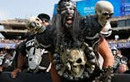 FILE - In this Sept. 13, 2015, file photo, Oakland Raiders fans watch during the second half of an NFL football game between the Oakland Raiders and t