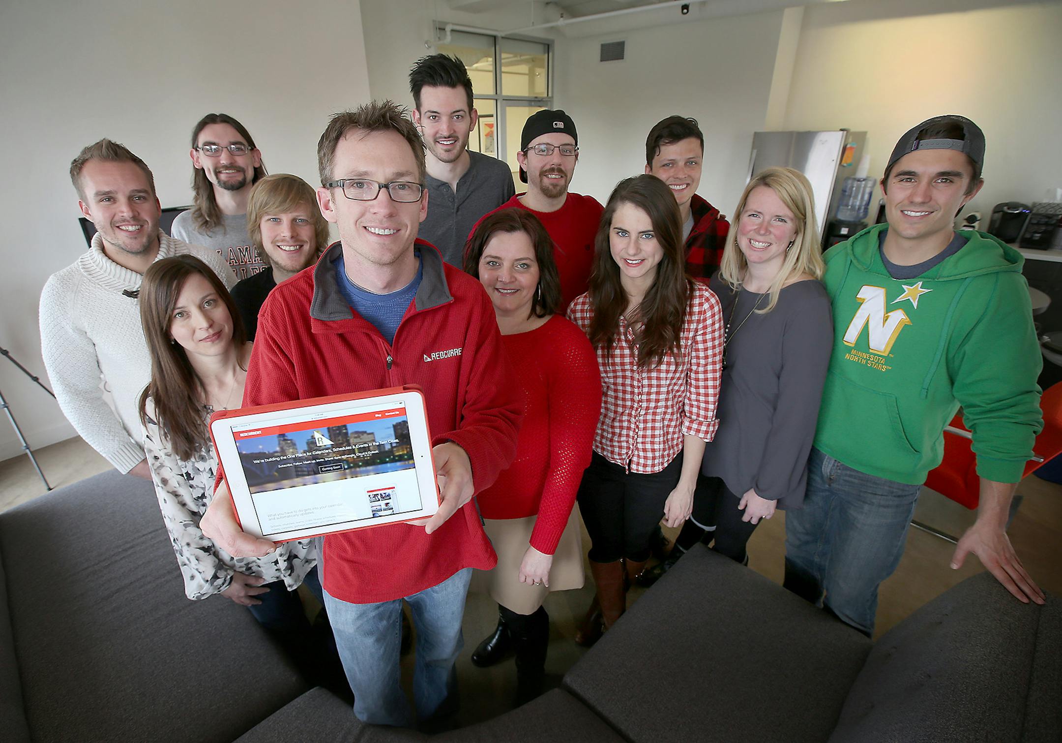 Peter Goddard held up an iPad with the Red Current iOS app that aggregates a user's calendars and includes a search tool to find events in the Minneapolis area, Friday, February 13, 2015 in Minneapolis, MN. The app is arranged by topic area like Beer or Libraries, ] (ELIZABETH FLORES/STAR TRIBUNE) ELIZABETH FLORES &#x2022; eflores@startribune.com