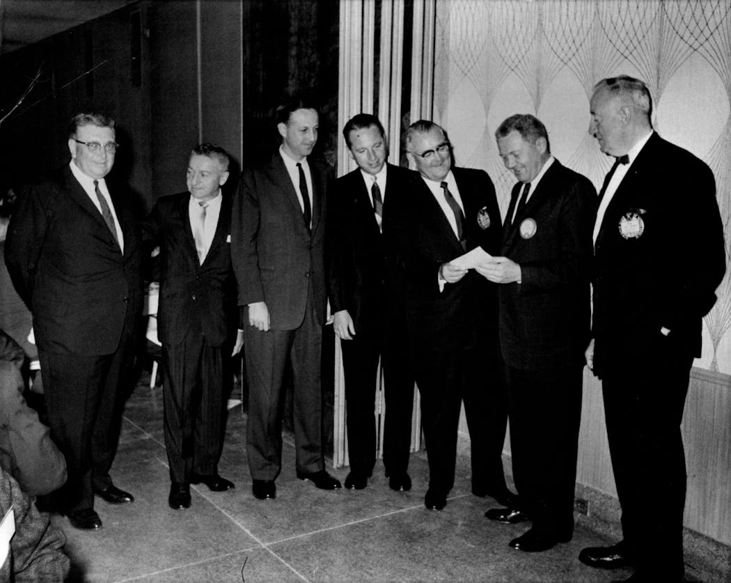 From left, H.P. Skoglund, Max Winter, Pete Rozelle; Bert Rose and Felton Colwell presented Vikings season ticket checks to Bill Boyer, president of the Vikings, in September of 1960.