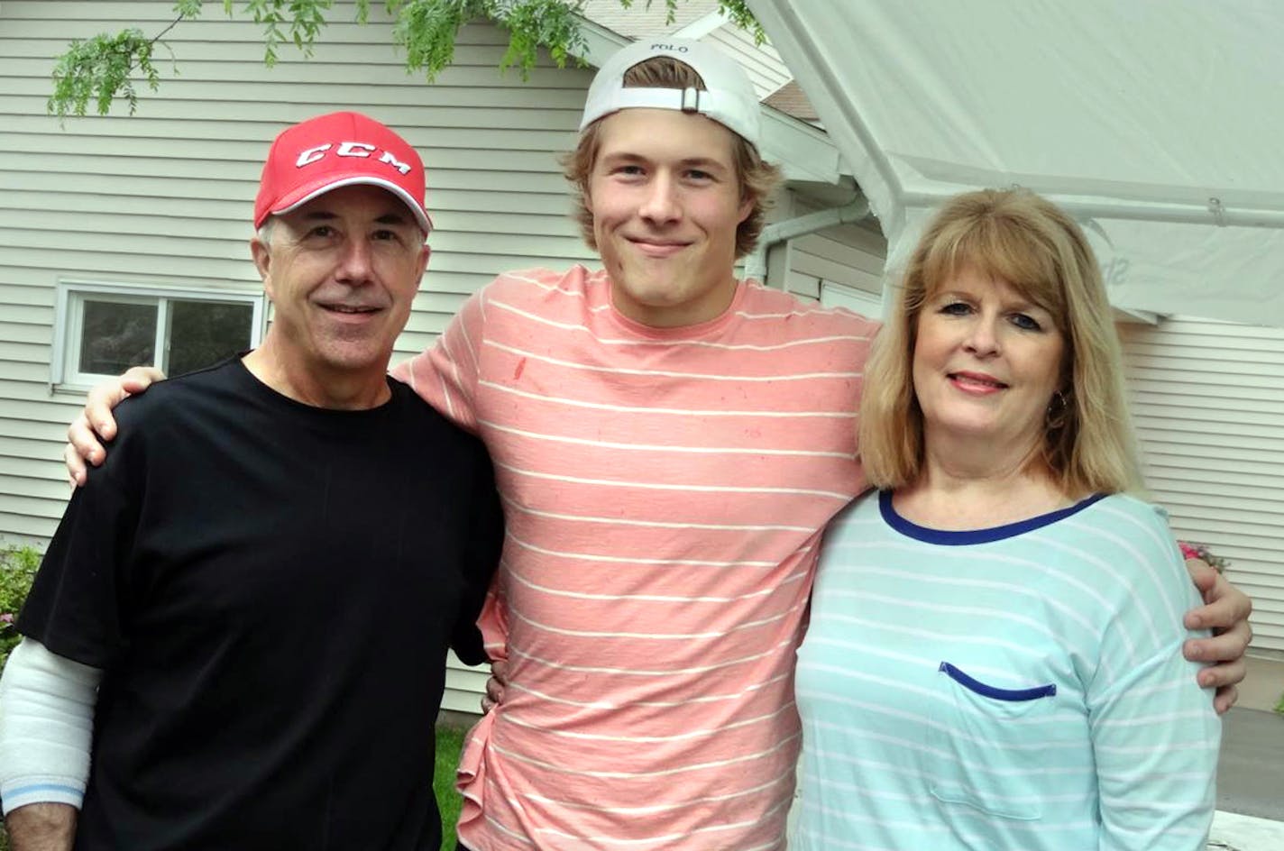 Duke Boeser, son Brock, and wife Laurie after high school graduation. The Boeser family has battled through Duke's serious illness. handout by family