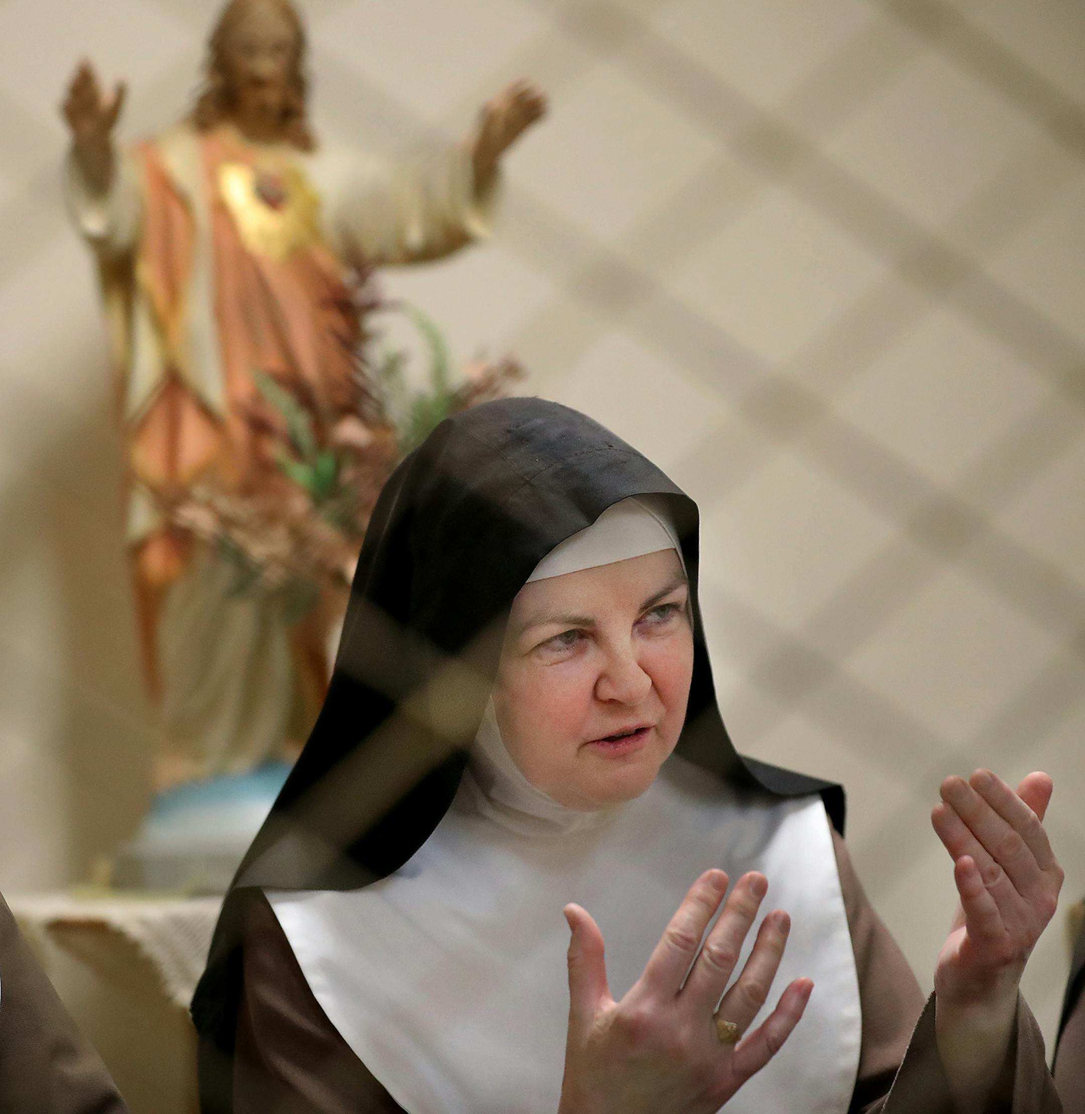 Poor Clare nuns of St. Clare's Monastery nuns met with journalists in the monastery's parlor, the one room where outsiders have partial access to the nuns in a room divided by a metal fencing with a folding wooden divider and seen Thursday, April 16, 2020, in Sauk Rapids, MN. Pictured is Sister Mary Matthew.