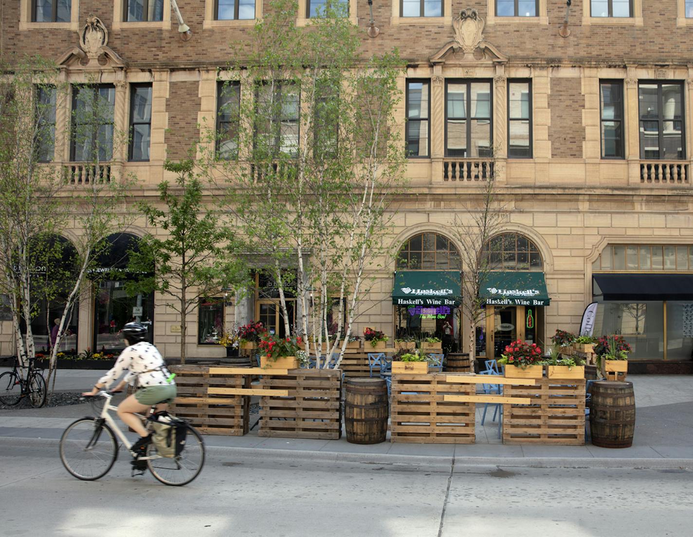 Nicollet Mall sidewalk cafes. The biggest one is the stretch of tables outside the Local, Barrio and Randle&#x2019;s, between 9th and 10th. The one that&#x2019;s shot straight on, with the Young Quinlan building in the background, is Haskell&#x2019;s Wine Bar. The one with the blue awnings is Zelo. [ Sidewalks Cafe's Photos by Rick Nelson