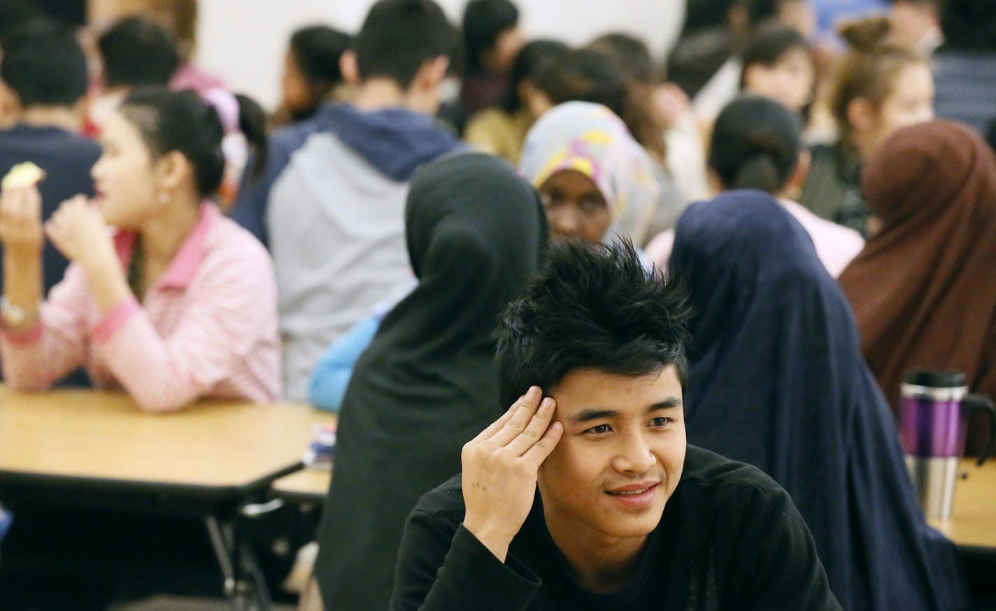 Pu Lu Ku 19, a student at Leap Academy High School talked with friends at lunchtime Friday March 13, 2015 in St. Paul, Minnesota. ] Pu grew up in Thailand; the student body has seen a number of changes in student population the past twenty years, reflecting a larger trend that Minnesota demographics are changing as well.] Jerry Holt/ Jerry.Holt@Startribune.com