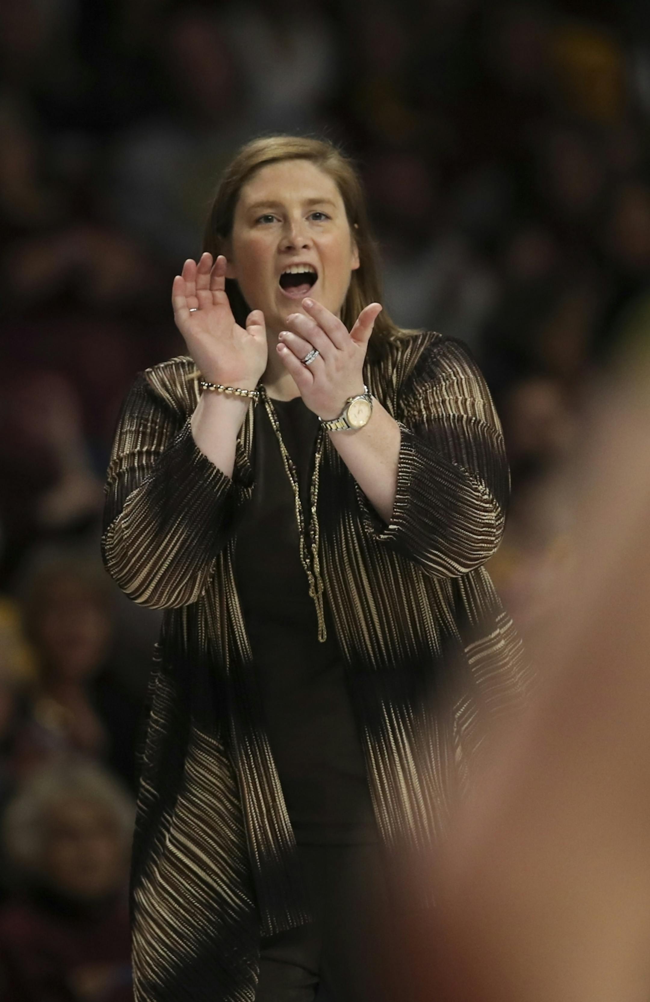 Minnesota Golden Gophers head coach Lindsay Whalen applauded her team in the second half.