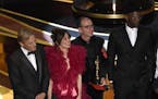 Viggo Mortensen, from left, Linda Cardellini, Dimiter Marinov and Mahershala Ali accept the award for best picture for "Green Book" at the Oscars on S