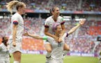 United States' Megan Rapinoe (15) and teammates celebrate after Rapinoe scored the opening goal from the penalty spot during the Women's World Cup fin