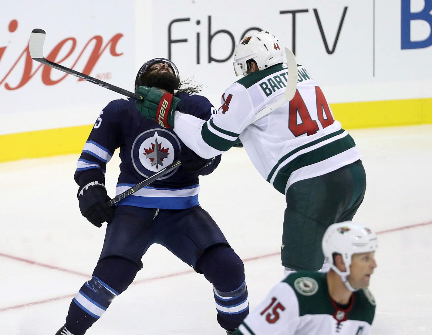 Wild defenseman Matt Bartkowski got his stick a little high on Winnipeg's Mathieu Perrault during Monday's preseason game.