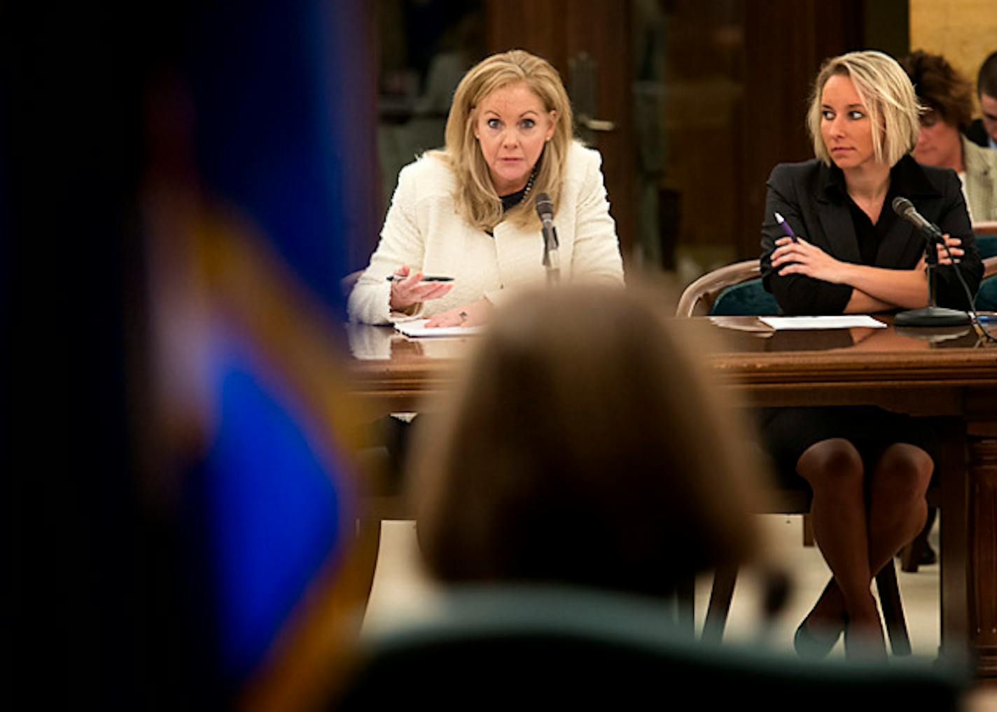 Maureen Bausch, left executive V.P. for business development at the Mall of America challenged Senator Ann Rest, foreground,  on her bill to impose sales tax on clothing.  On the right is Rochelle Westlund of the Minnesota Retailers Association who also opposes the bill.  Wednesday, January 16, 2013.   Bausch said a considerable amount of the malls business comes from out of state people looking to avoid the tax.  ]   GLEN STUBBE * gstubbe@startribune.com