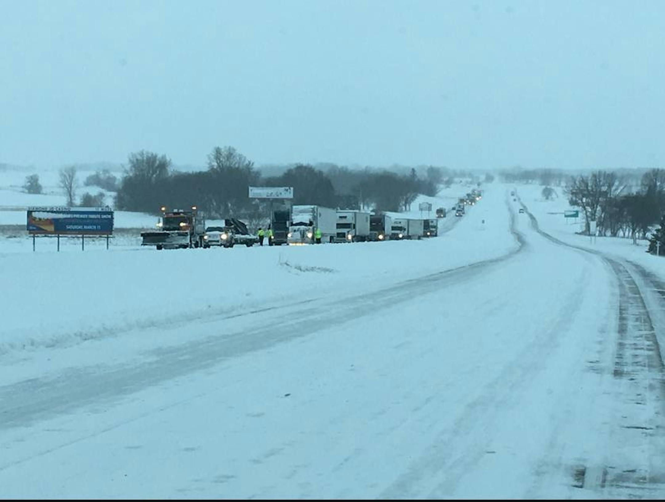 Traffic is stopped and backed up on northbound I-35 at mile marker 8, just south of Albert Lea. Trucks can't get up the hill.