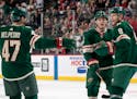 Mikko Koivu of the Minnesota Wild (9) celebrated with teammates after scoring a goal in the first period. ] CARLOS GONZALEZ • cgonzalez@startribune.