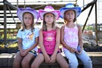 From left, identical twins Brooklyn, Zoey and Mackenzie, 6, from Brooklyn Park, sat for a portrait at the Hamel Rodeo.