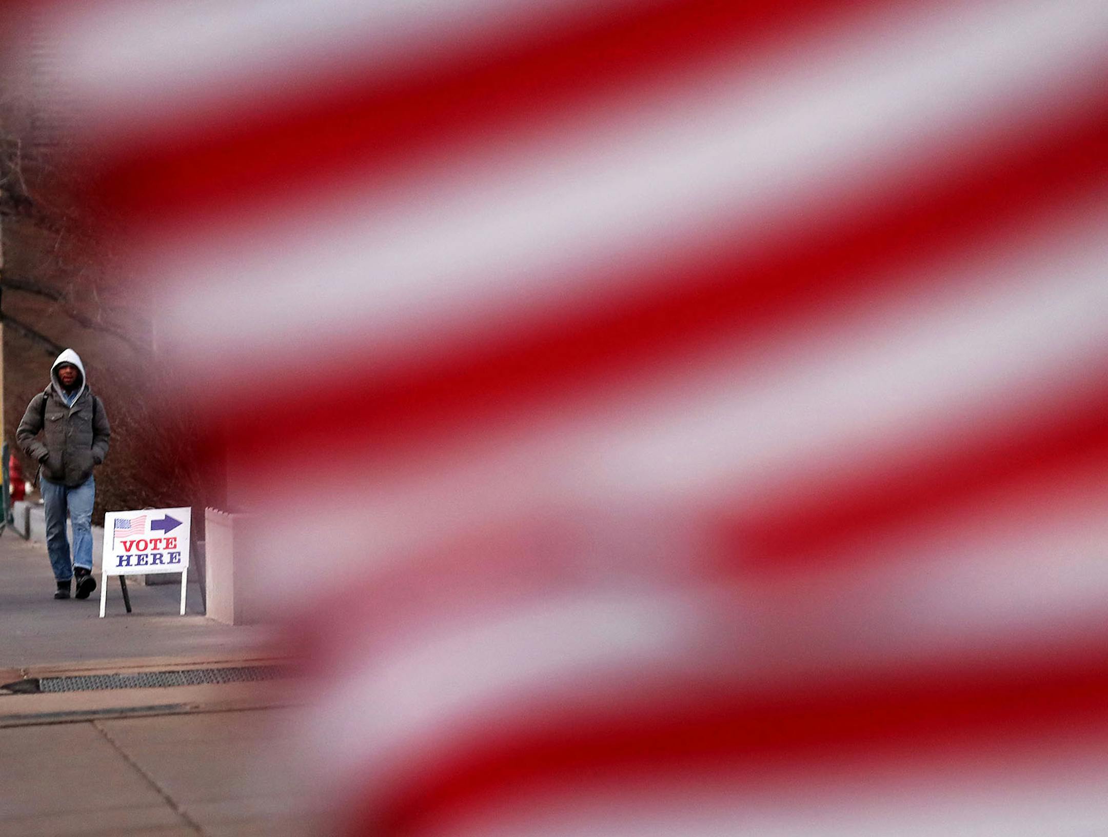 A pedestrian outside the polling place at Westminster Presbyterian Church in downtown Minneapolis before the polls opened for the Minnesota presidential primary on Tuesday.