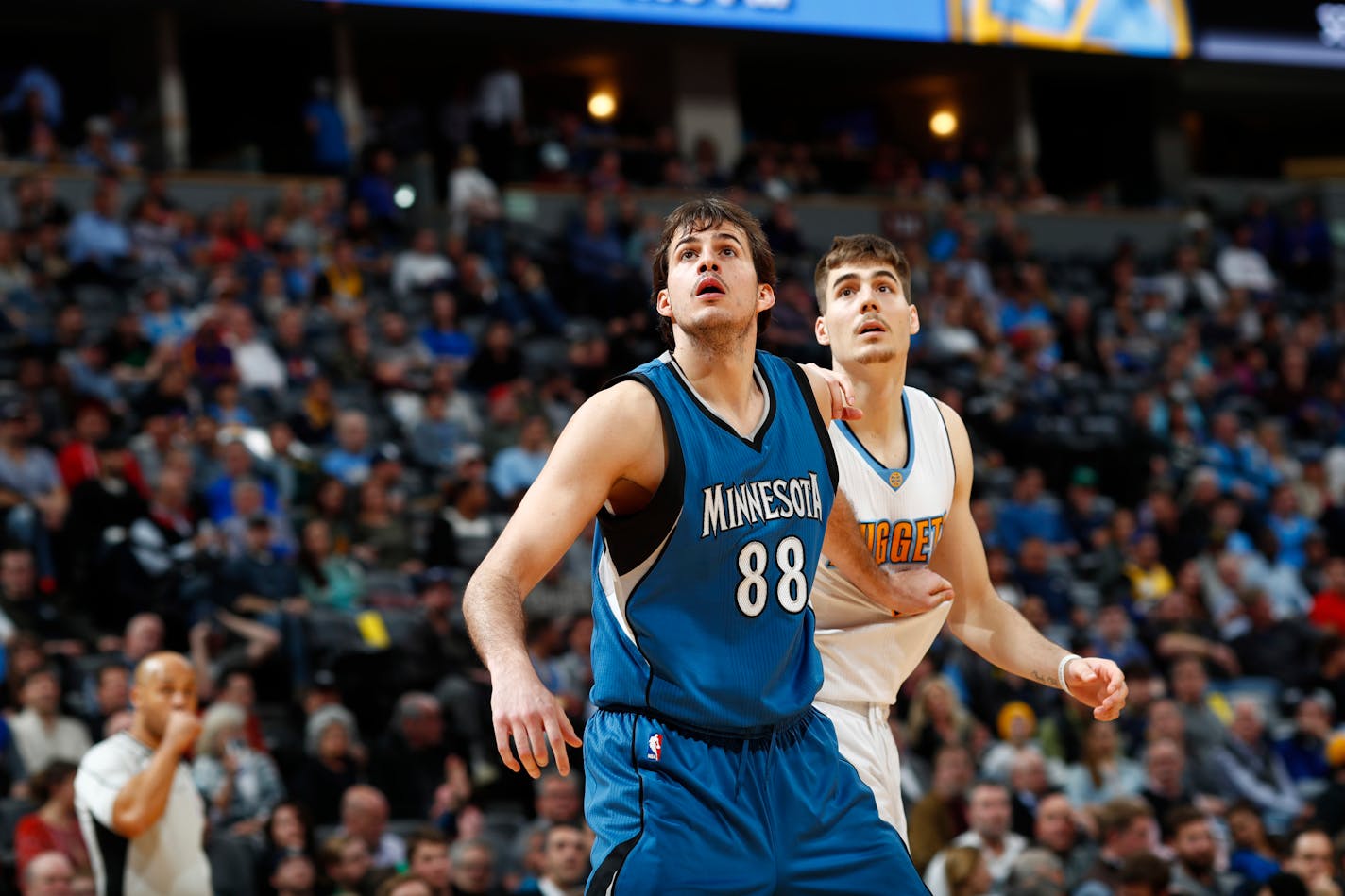 Minnesota Timberwolves forward Nemanja Bjelica (88) and Denver Nuggets forward Juancho Hernangomez (41) in the second half of an NBA basketball game Wednesday, Feb. 15, 2017, in Denver. The Timberwolves won 112-99. (AP Photo/David Zalubowski)