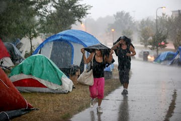 An American Indian encampment in south Minneapolis, shown in August during heavy rain.