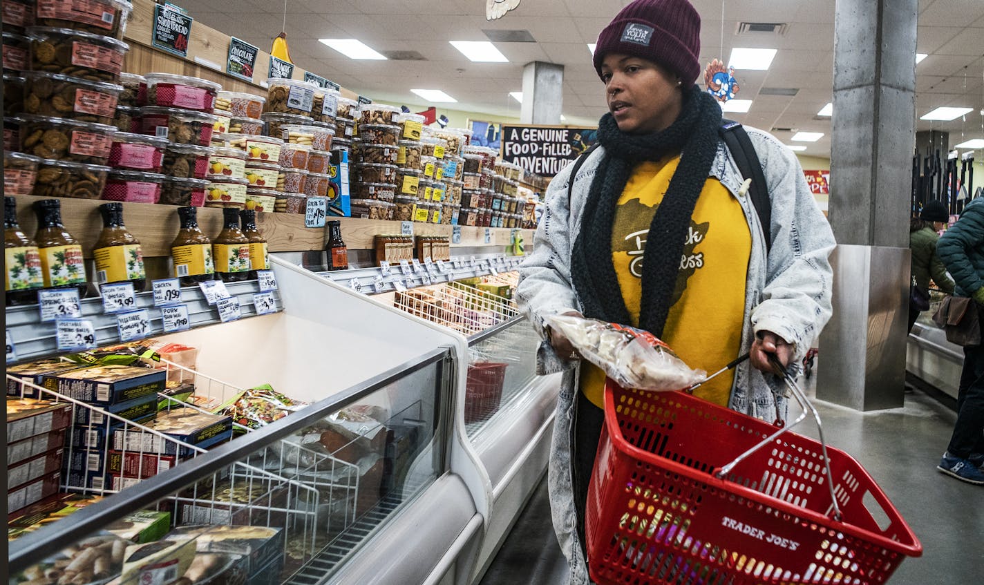 Ashley Bradford, who lives in the Elliot Park neighborhood walks to Trade Joe's to get some groceries including dumplings. In the heart of winter, she takes the bus.