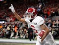 Alabama wide receiver DeVonta Smith (6) celebrates his touchdown during overtime of the NCAA college football playoff championship game against Georgi