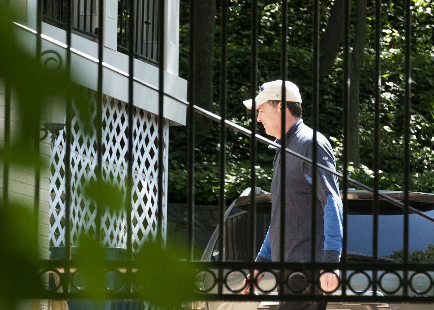 Former FBI Director James Comey walks at his home in McLean, Va., Wednesday, May 10, 2017. President Donald Trump fired Comey on Tuesday, ousting the nation's top law enforcement official in the midst of an investigation into whether Trump's campaign had ties to Russia's election meddling.