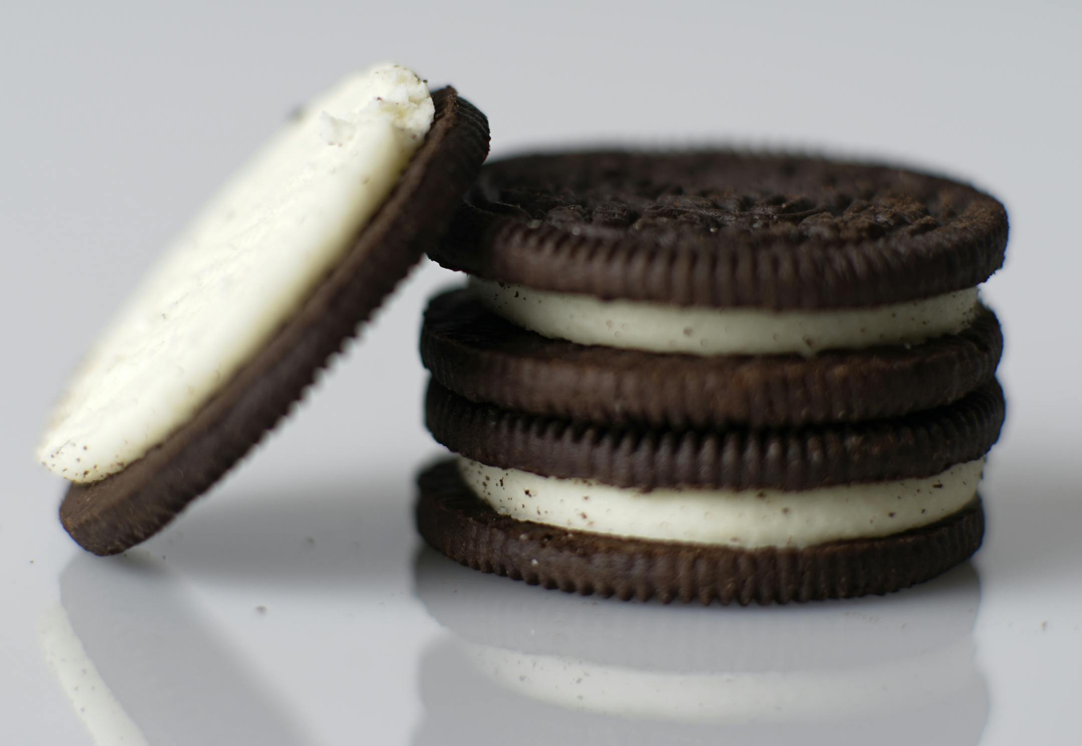 Grace equipment stuffs the cream in the Oreo Cookies.] Sweet toothers owe a debt of gratitude to Graco Inc., the seemingly innocuous pump and spray equipment firm that makes many of America's snacks possible. Graco's equipment sprays the shell on M&Ms, stuffs cream into Oreos, coats Doritos with orange cheese and even stuffs peanut butter into Reese's cups.Richard Tsong-Taatarii/rtsong-taatarii@startribune.com